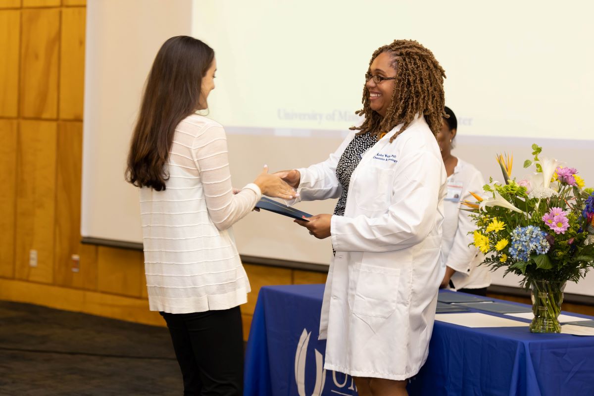 Student accepting an award at the 2023 Honors and Awards Ceremony